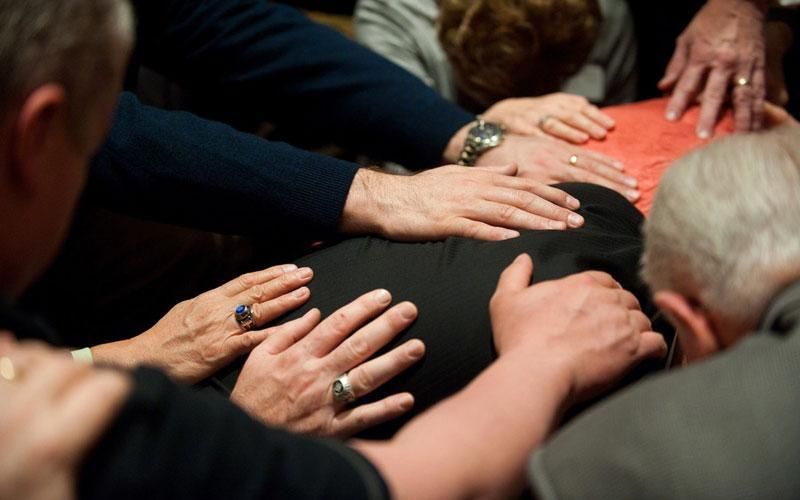 healing - laying on hands to heal the sick