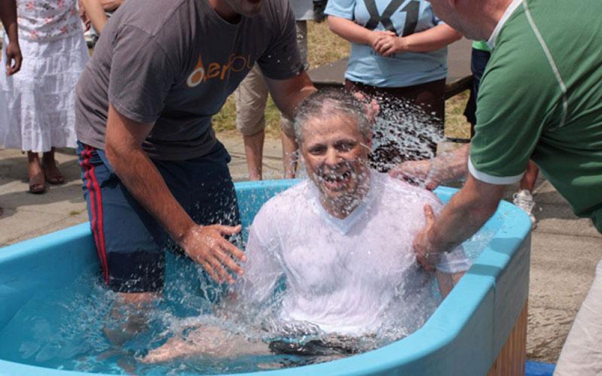 Nigel Maine being baptised in June 209